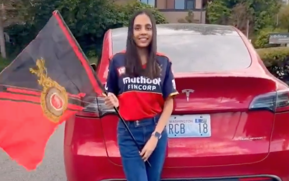 Virat Kohli Fan Displays RCB Number Plate on Her Tesla [Watch Video]