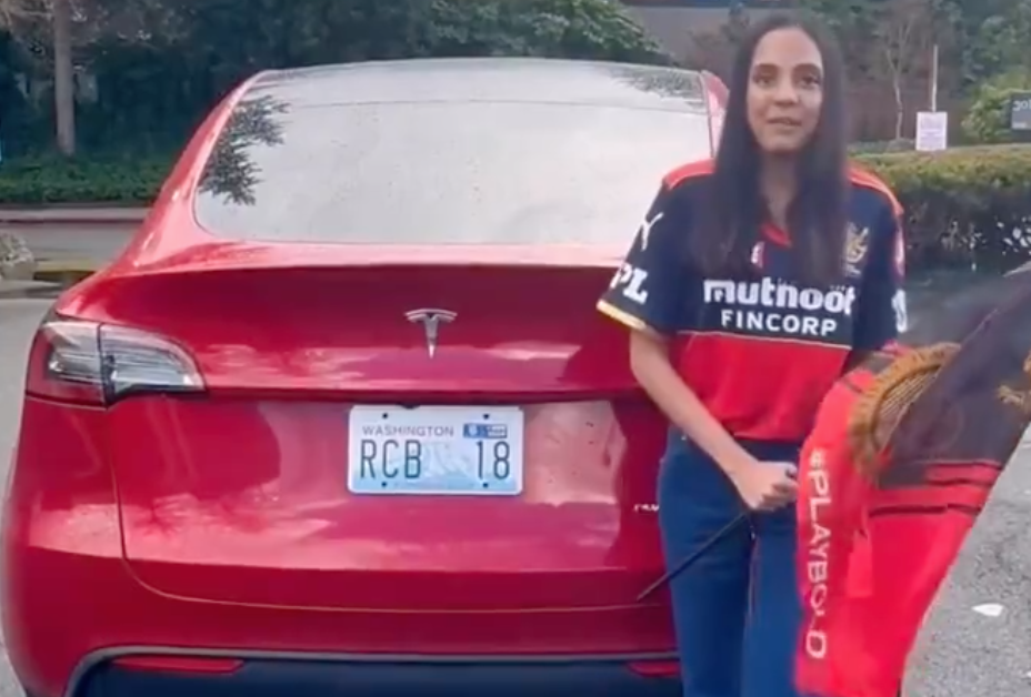 Virat Kohli Fan Displays RCB Number Plate on Her Tesla [Watch Video]