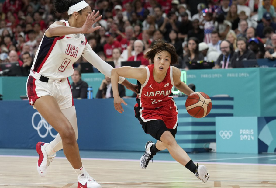 US women's basketball team starts their title defense with a win against Japan