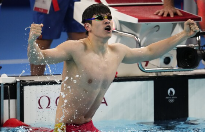 China's Pan Zhanle breaks his own world record to win gold in the men’s 100-meter freestyle at the Olympics