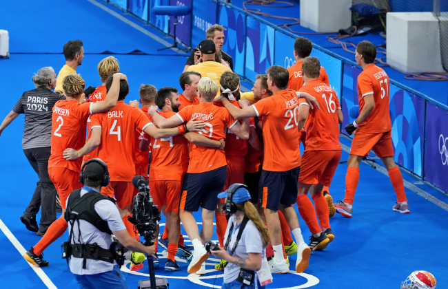 Netherlands defeats Germany in shootout to win field hockey gold.