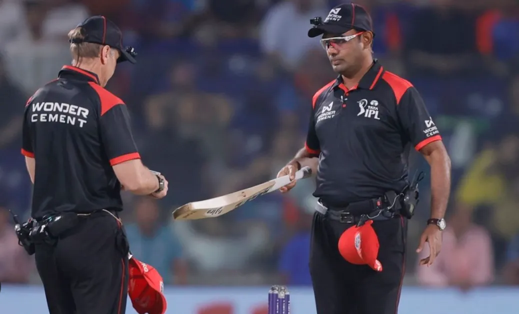 Umpires Inspect Bat Sizes During Sunday's Double-Header Matches