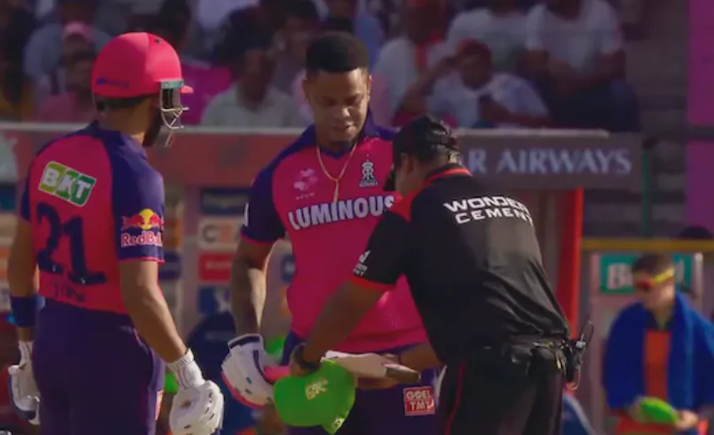 Umpires Inspect Bat Sizes During Sunday's Double-Header Matches